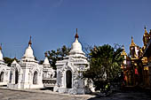 Myanmar - Mandalay, Kuthodaw Pagoda. 729 white pitaka pagodas contain the Tipitaka, the sacred texts of Theravada Buddhism. 